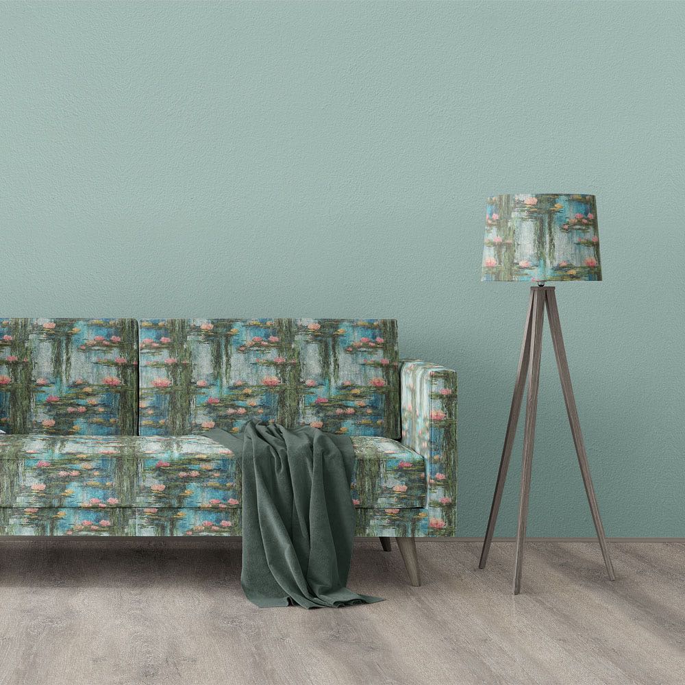 Giverny No.5 impressionist style upholstery fabric displayed on sofa and lampshade with water lilies, blue reflections and painterly garden scene