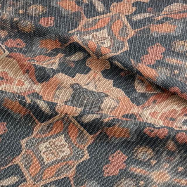 Soft terracotta and smoky grey upholstery fabric with a woven floral design