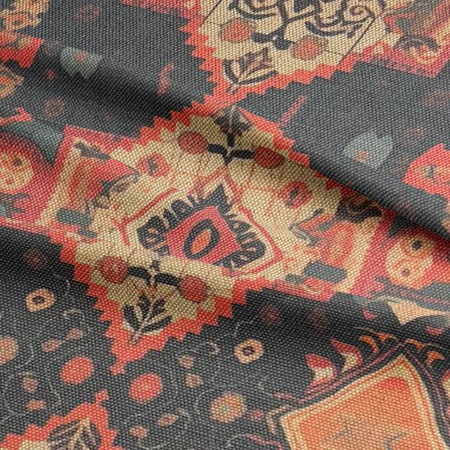 Rust and charcoal woven upholstery fabric with symmetrical kilim-style design