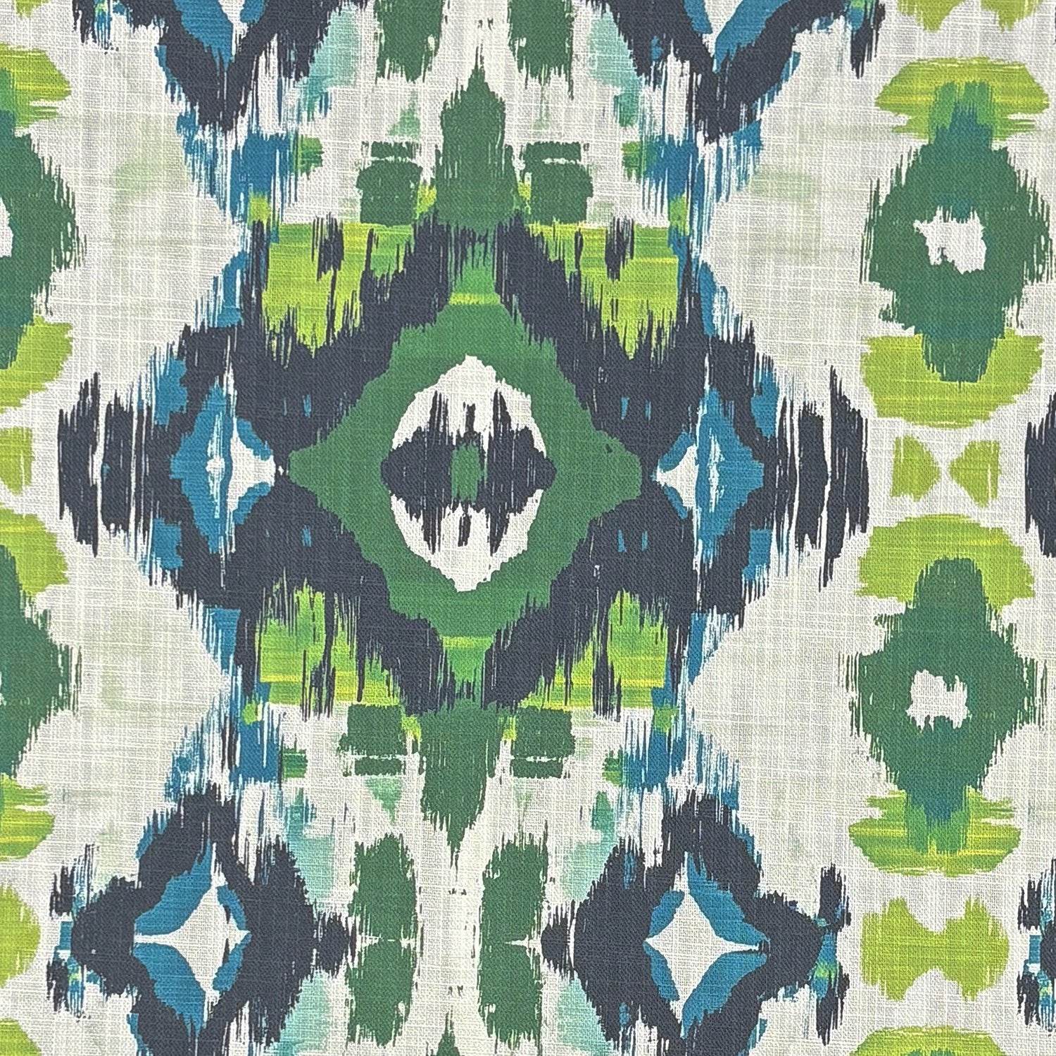 Flat image of Kilim No.22 upholstery fabric with green, blue, and black ikat-style geometric pattern on a linen-blend background