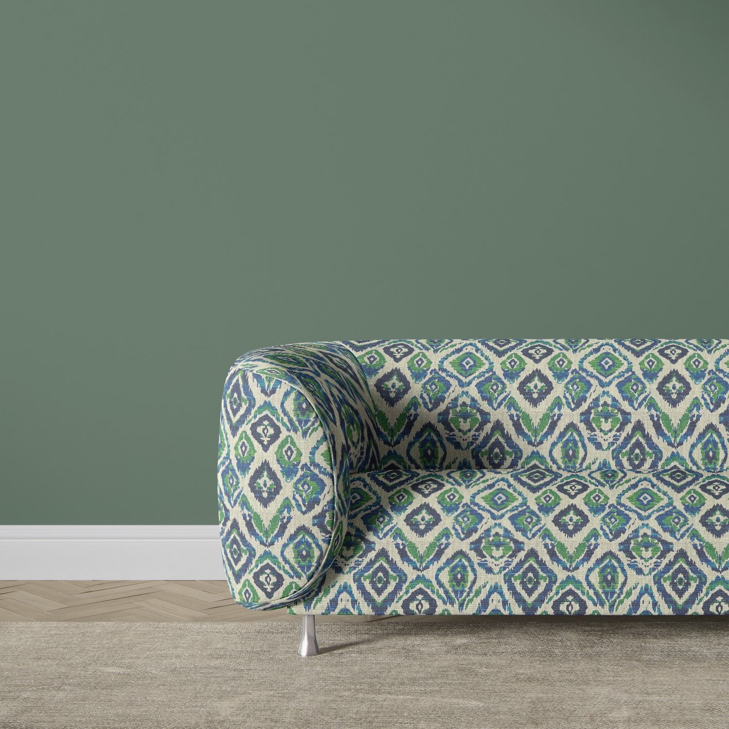 Contemporary sofa upholstered in Kilim No.24 upholstery fabric with bold ikat-inspired pattern in green, blue, and navy