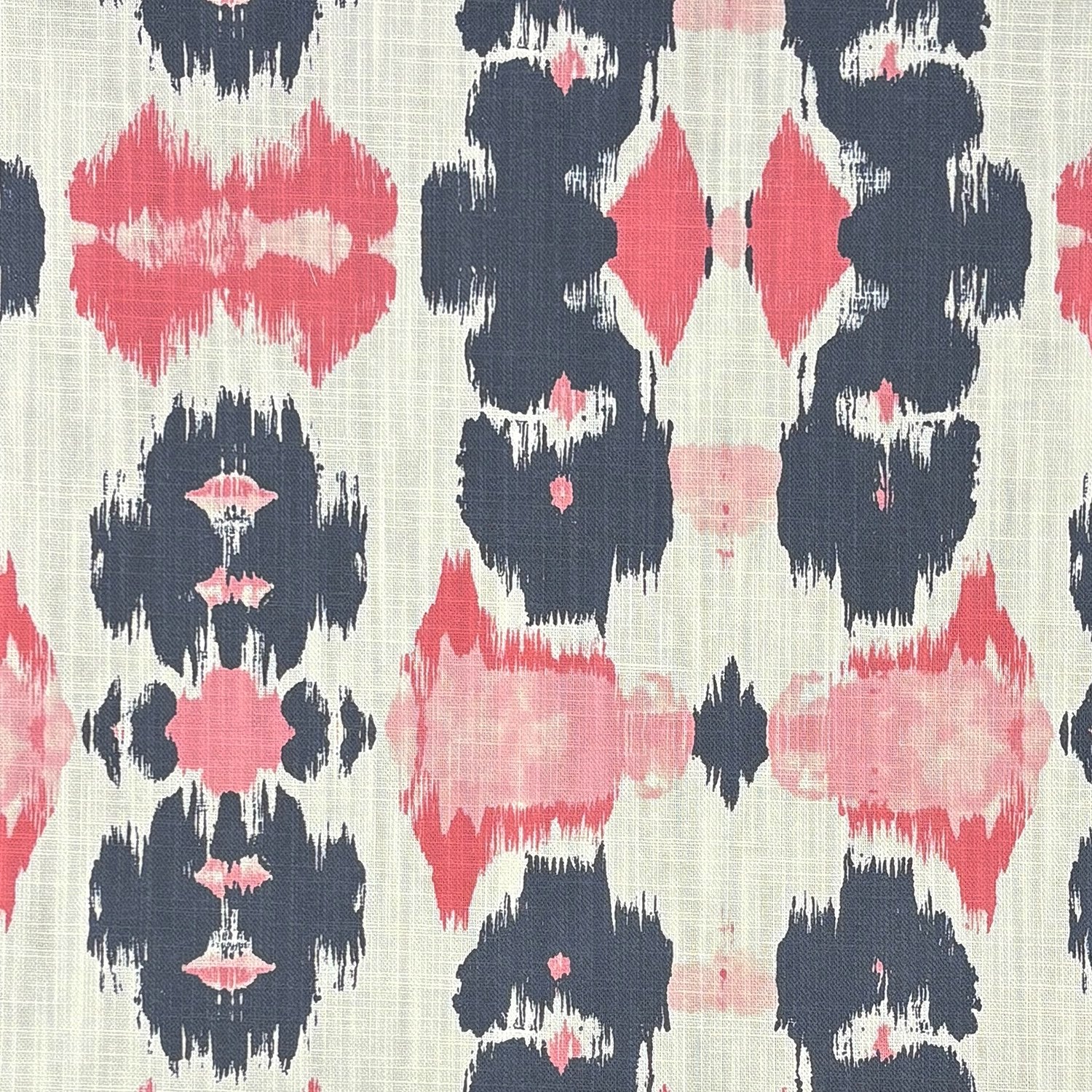 Kilim No.31 upholstery fabric on a modern barrel armchair – red, charcoal, and blush geometric pattern