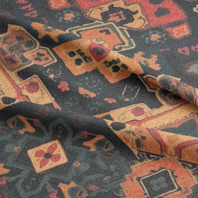 Close-up of woven kilim-style upholstery fabric in warm brown and charcoal tones