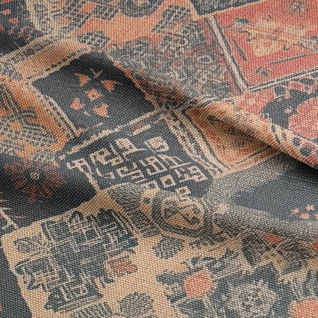 Bright bold upholstery fabric in warm tones with textured patchwork design