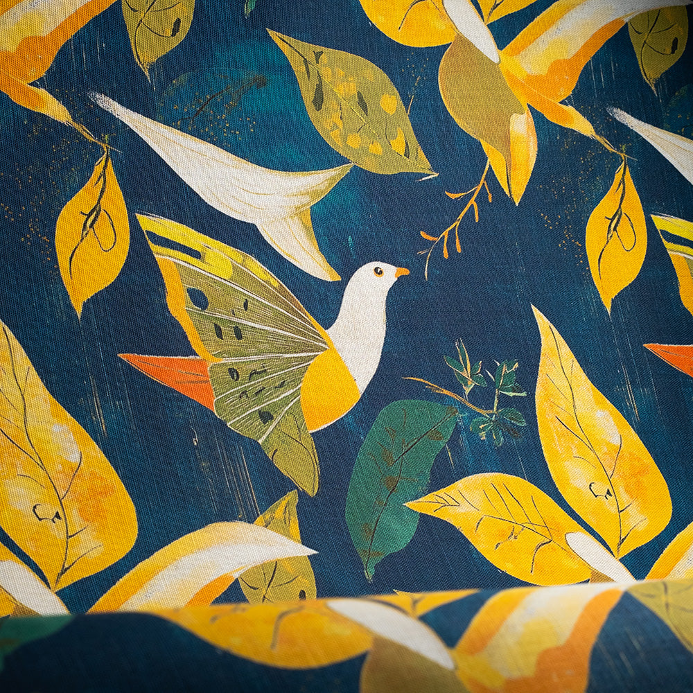 Luxury upholstery fabric featuring white birds and leaf detailing in gold and navy