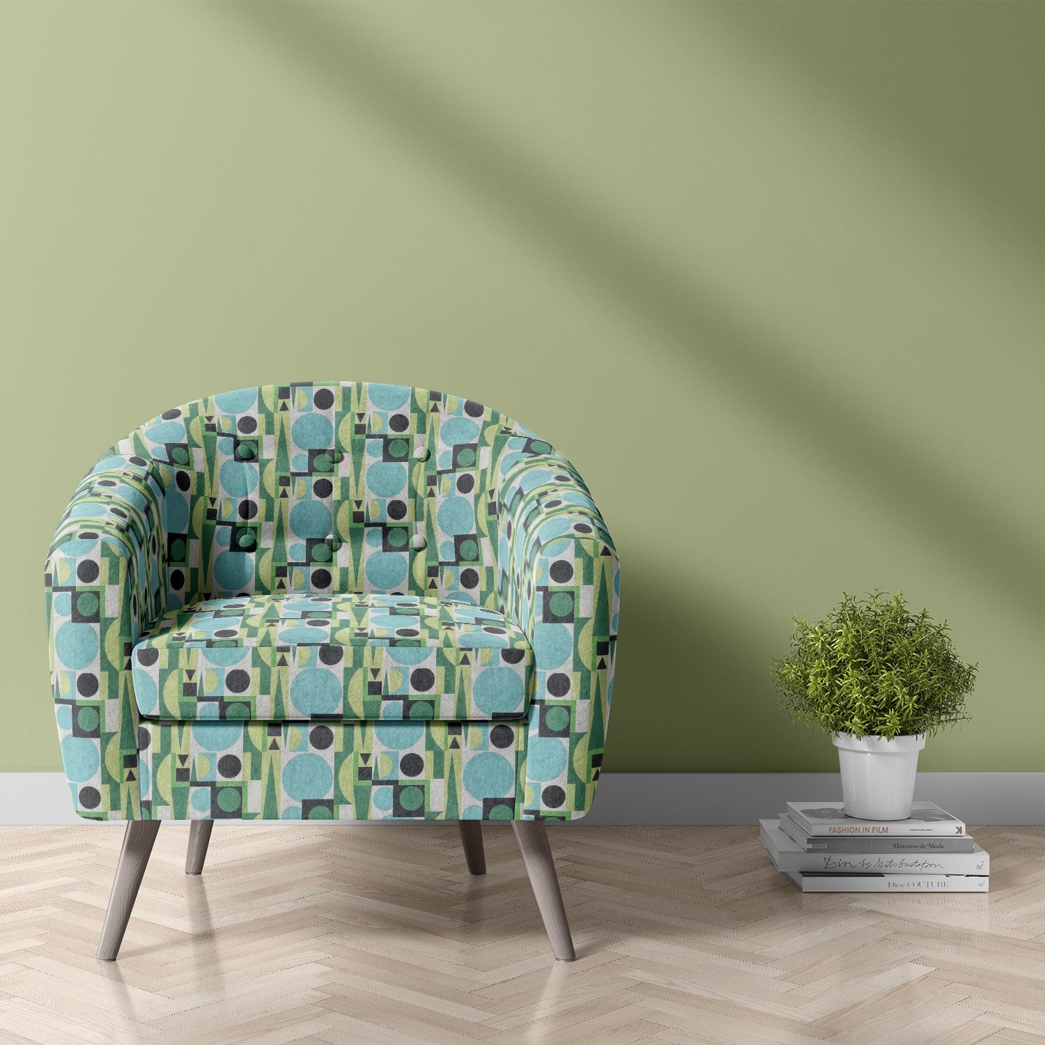 Malaga No.23 bold cubist geometric green and blue patterned upholstery fabric on armchair