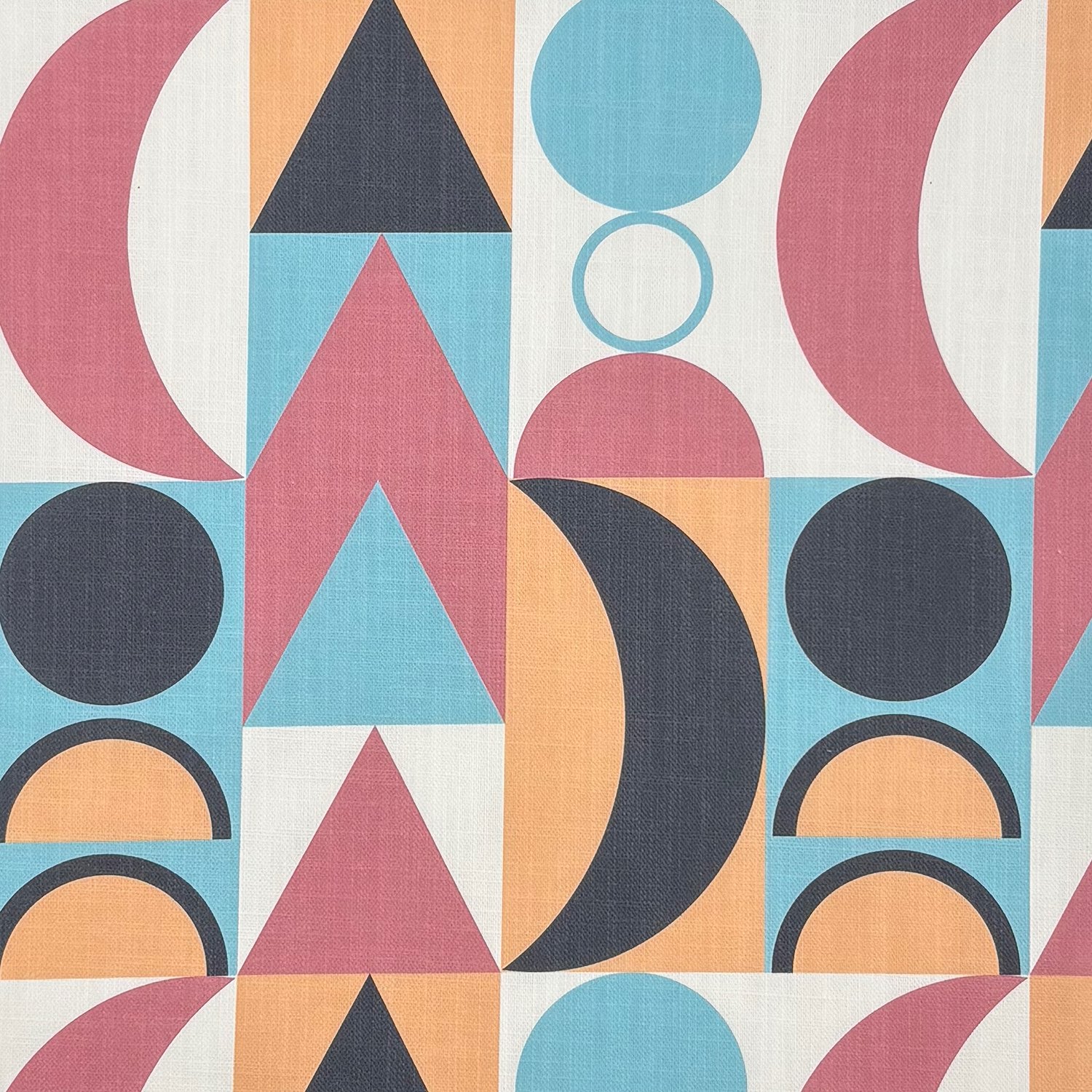 Malaga No.26 cubist geometric patterned upholstery fabric in pink, teal, ochre, and charcoal