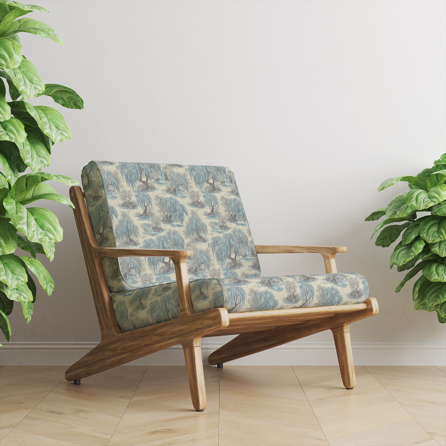 Light blue and white Japanese upholstery fabric armchair with delicate tree pattern in a bright interior setting