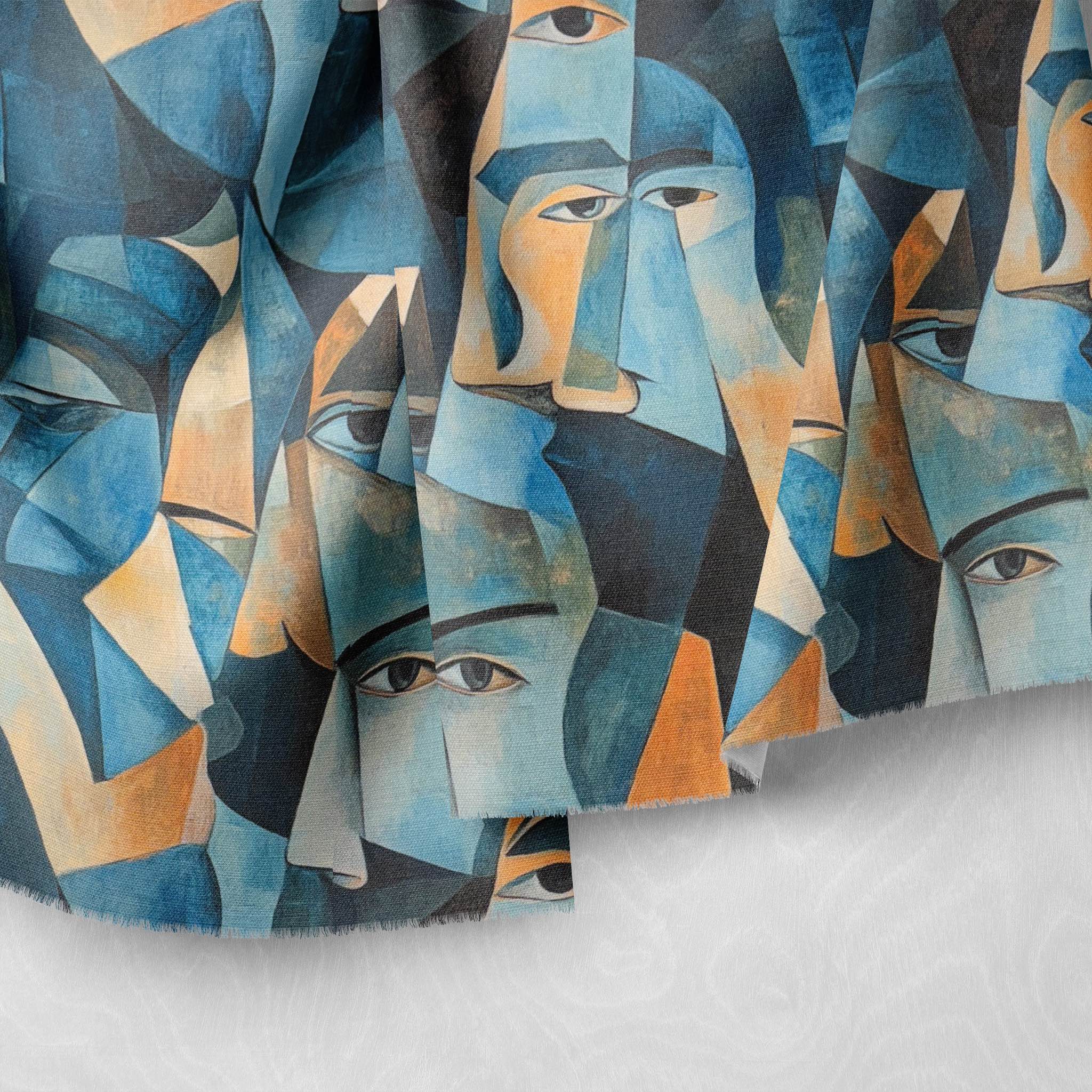 Draped Mougin No.21 Upholstery Fabric showing painterly blue geometric forms and facial motifs