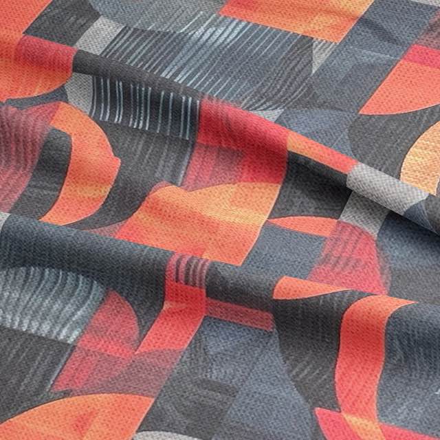 Close-up of blue and orange abstract upholstery fabric with geometric brushstroke detail