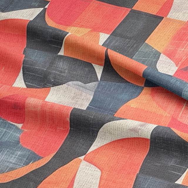 Textured orange upholstery fabric with navy and ivory curves – close-up view