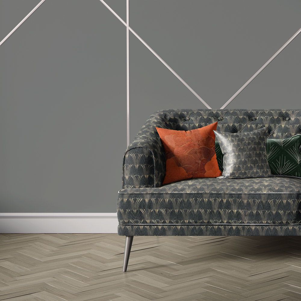 Nouveau Velvet No.11 black printed velvet fabric upholstered on sofa featuring repeating Art Deco fan pattern with gold decorative accents