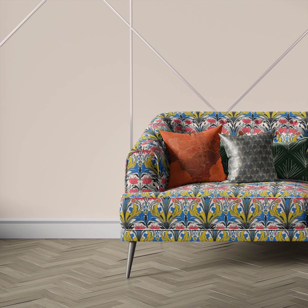 Nouveau Velvet No.2 velvet curtain and upholstery fabric displayed on sofa featuring colourful Art Nouveau floral pattern and decorative detailing