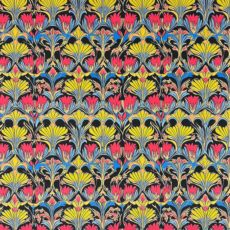 Art Nouveau printed velvet upholstery fabric featuring coral pink, yellow and blue floral motifs with decorative botanical pattern on a dark background