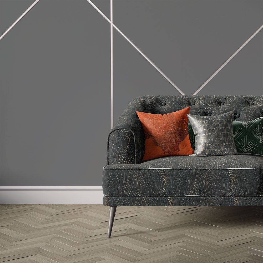 Nouveau Velvet No.8 printed velvet fabric upholstered on sofa featuring black background with sweeping gold Art Deco line design