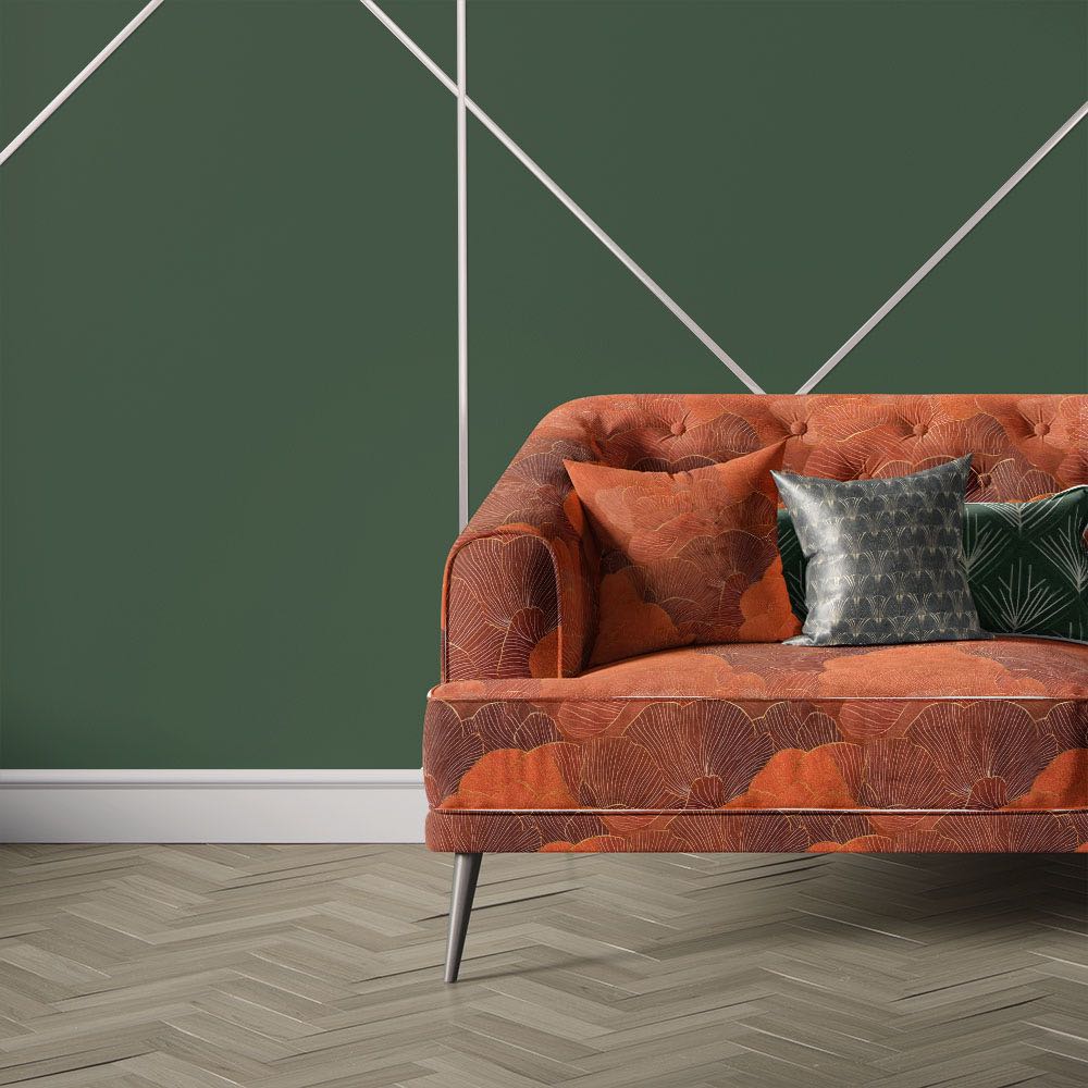 Nouveau Velvet No.9 printed velvet fabric upholstered on statement sofa featuring large-scale orange floral design inspired by Art Nouveau styling