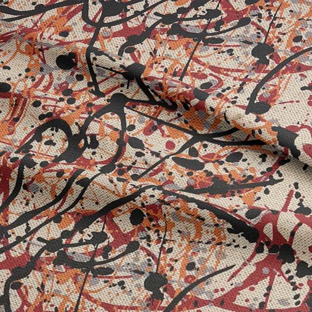 Close-up of textured statement upholstery fabric with black and terracotta strokes