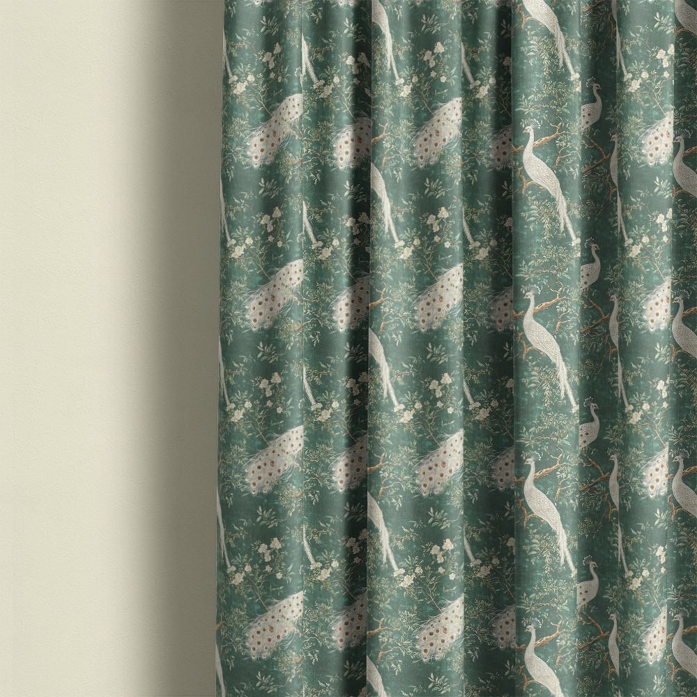 Pavone No.11 peacock curtain fabric shown as full length curtains with white peacock motifs, soft green linen base and delicate floral pattern