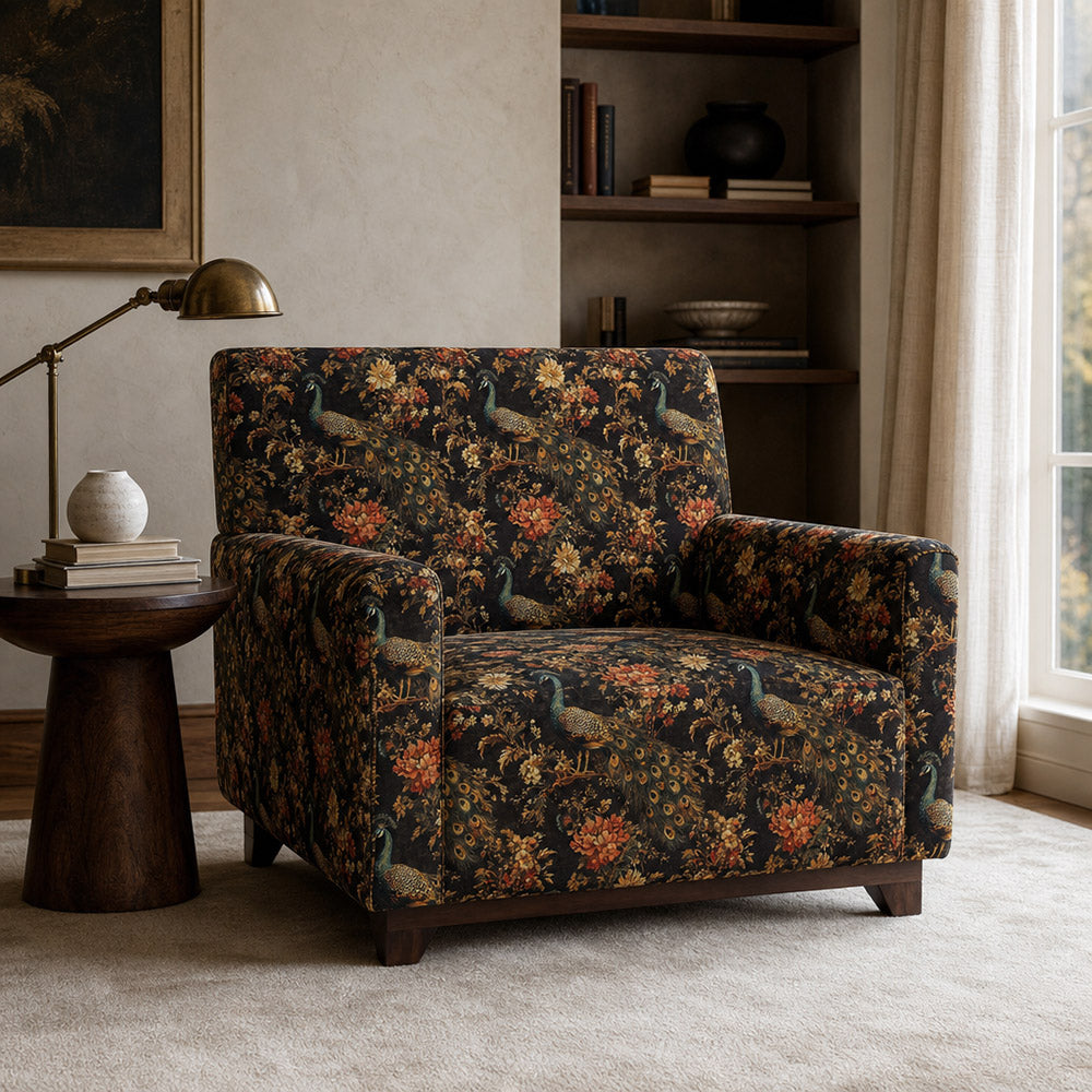 Accent chair upholstered in Pavone No.10 dark peacock velvet with warm terracotta botanical tones
