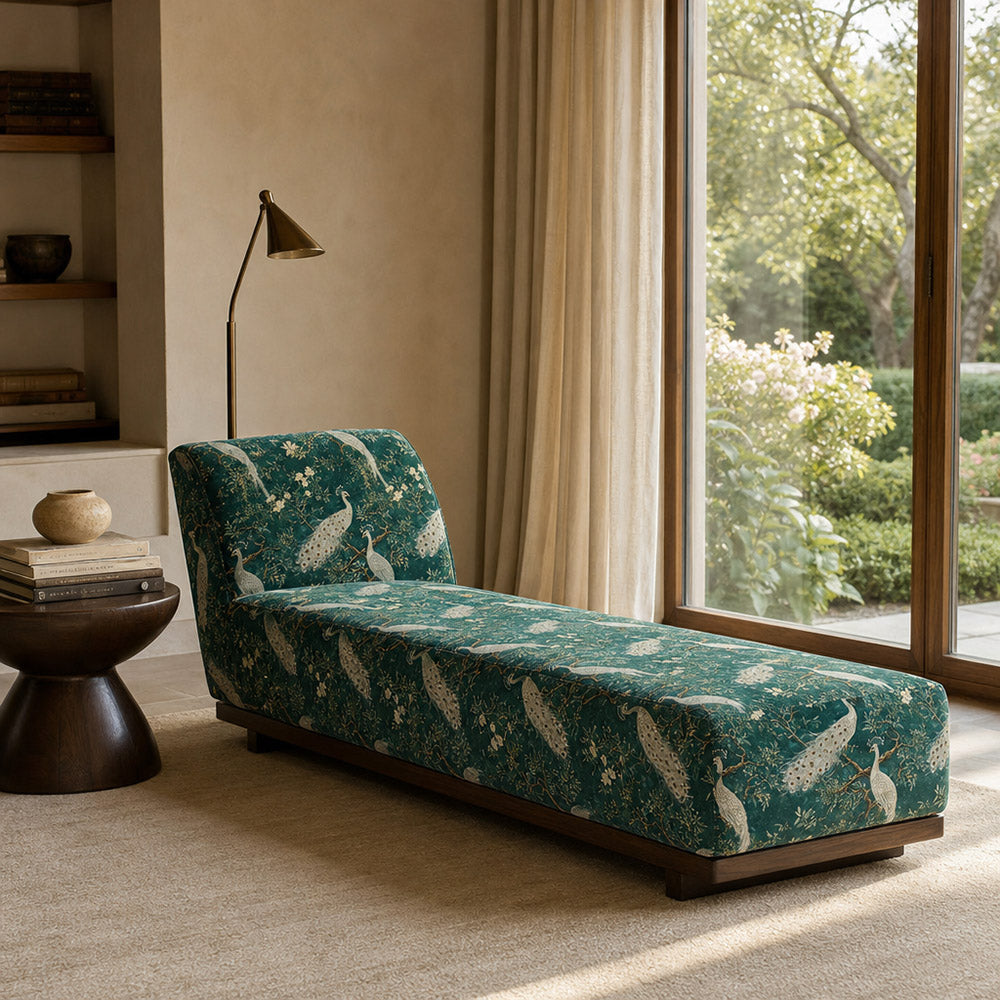 Curved chair upholstered in Pavone No.11 emerald green peacock velvet fabric