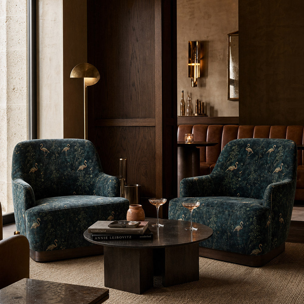 Pair of dining chairs upholstered in Pavone No.2 dark green printed bird velvet fabric