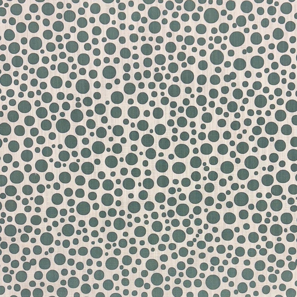 Close-up of Pointillia No.2 printed upholstery fabric featuring an organic green dot pattern on a linen-blend weave.