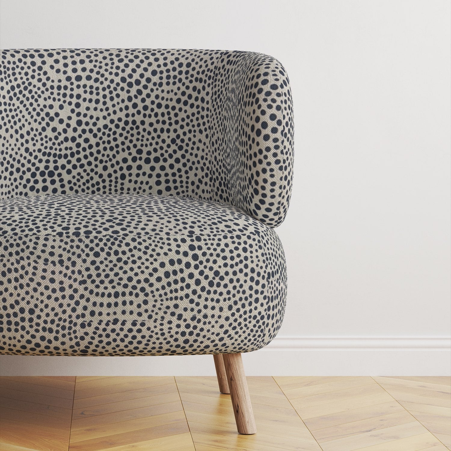 Modern upholstered sofa covered in Pointillia No.6 fabric, showcasing its dynamic navy design and intricate texture.