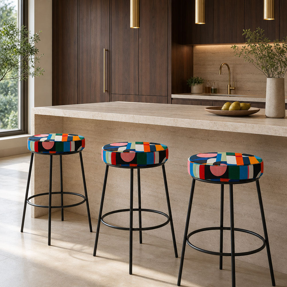 Populist No.1 Crib5 velvet fabric upholstered on statement stools in a colourful interior scheme