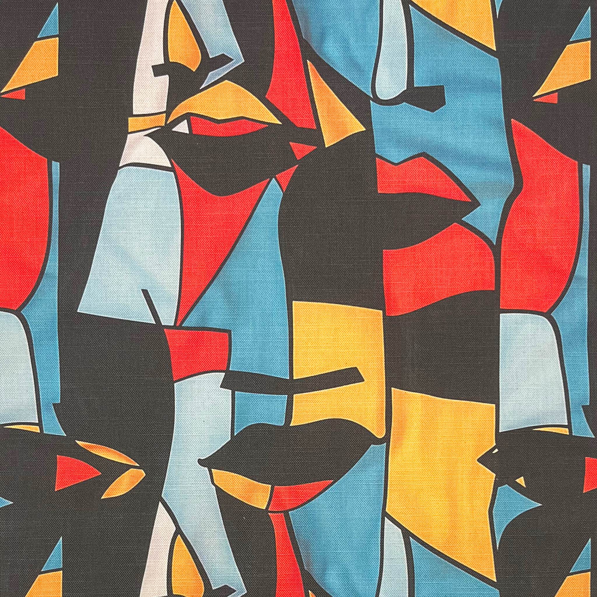 Multicoloured upholstery fabric with bold sculptural faces – Sculpture No.2 flat lay