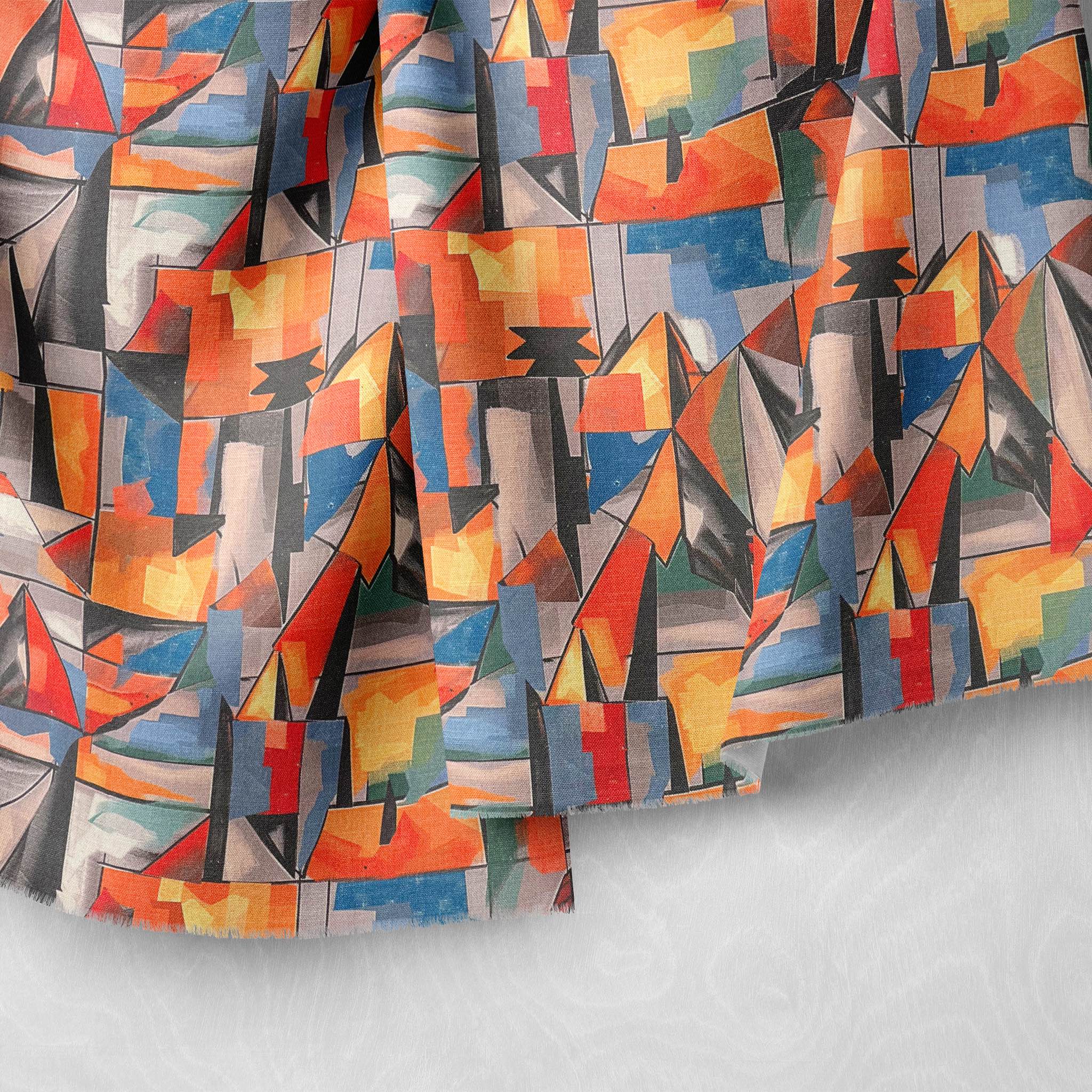 raped angular abstract fabric with coral, navy, and ochre shapes