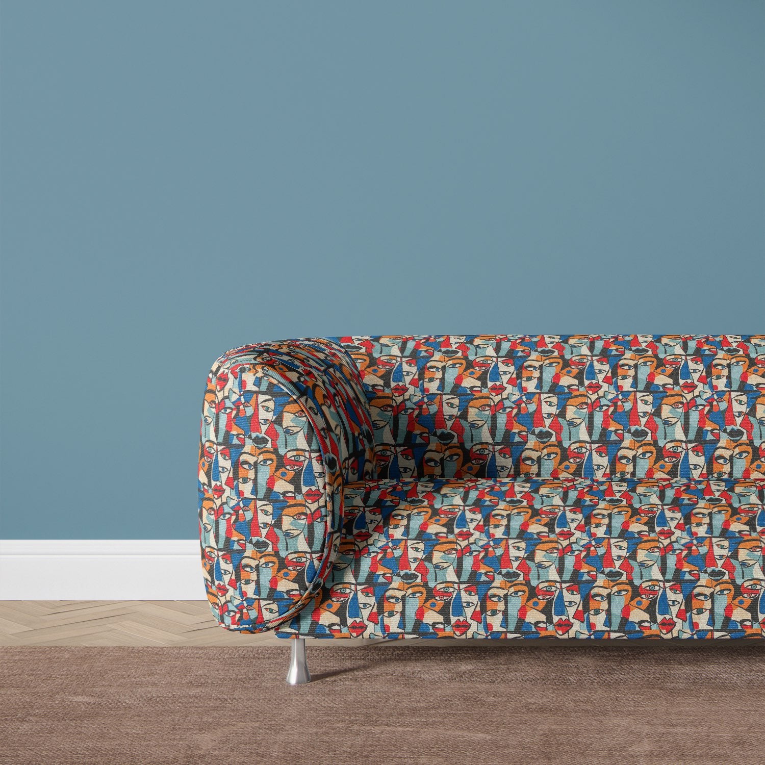 Sculpture No.7 fabric upholstered on a modern sofa, showcasing bold abstract face patterns in vibrant hues for statement interior decor.