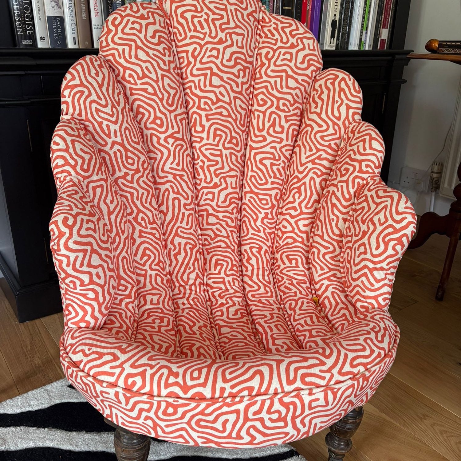 Armchair upholstered in Simplicity No.11 orange upholstery fabric with abstract line pattern