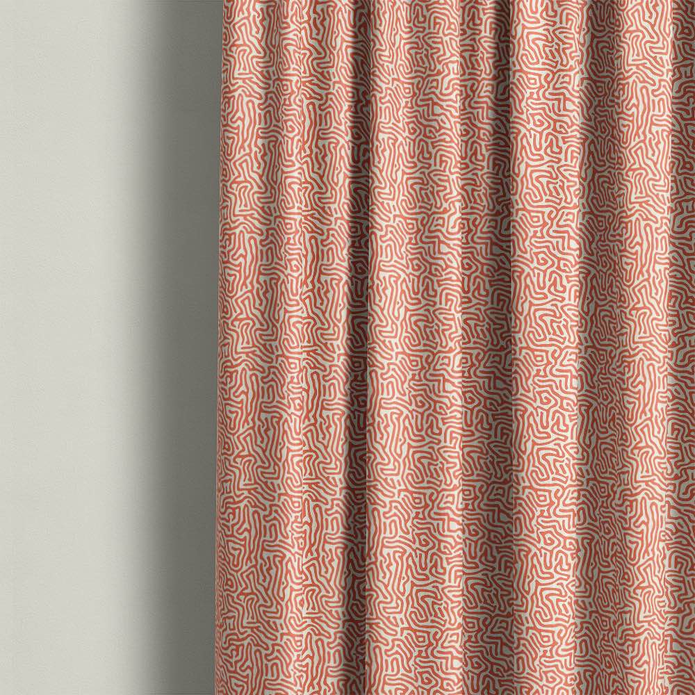 Contemporary orange abstract printed linen curtain fabric with maze inspired organic pattern in modern interior setting