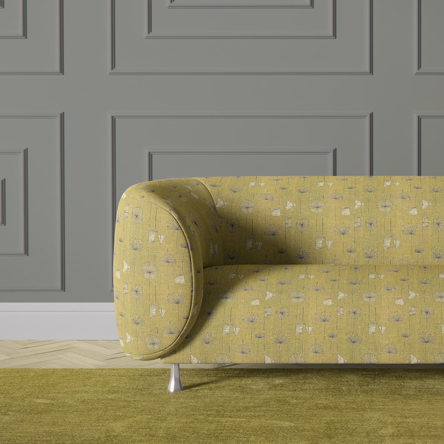 Sofa upholstered in olive green retro floral fabric with white triangle accents