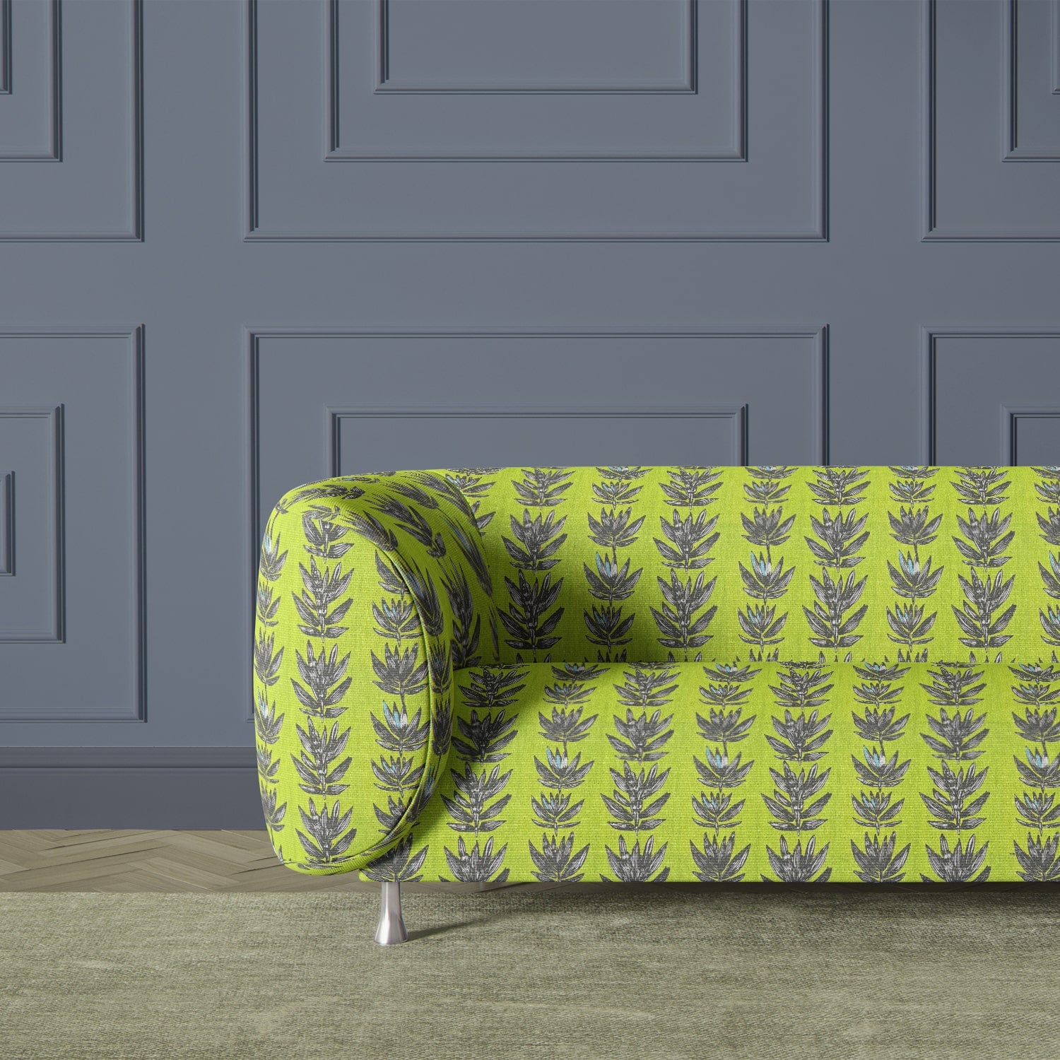 Retro sofa upholstered in bold green botanical abstract fabric