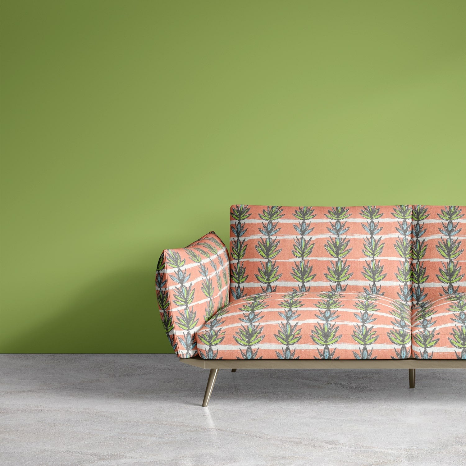 Retro sofa upholstered in pink and green abstract leaf print fabric