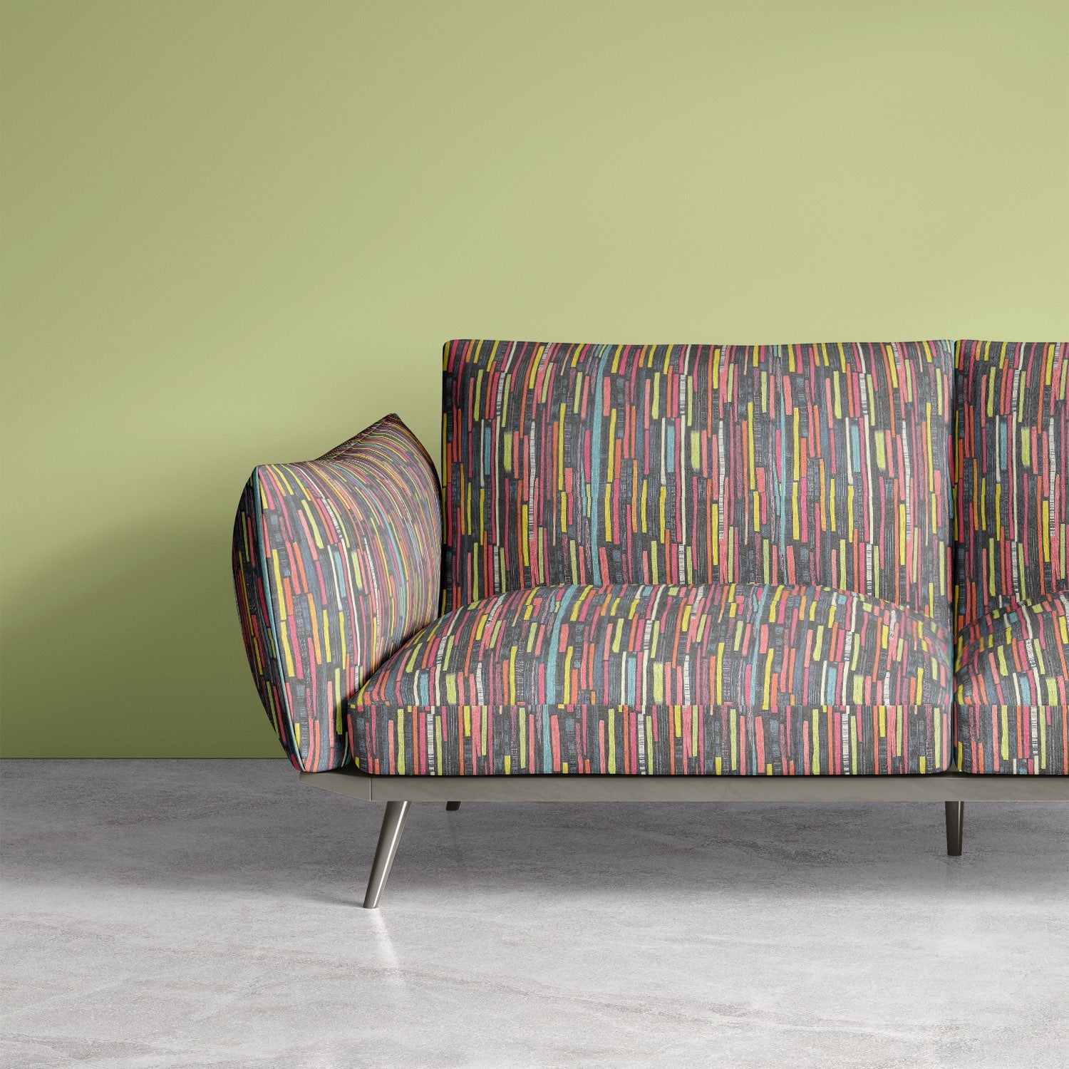Sofa upholstered in Striped No.8 upholstery fabric with multicoloured brushstroke stripes in red, yellow, aqua, and charcoal