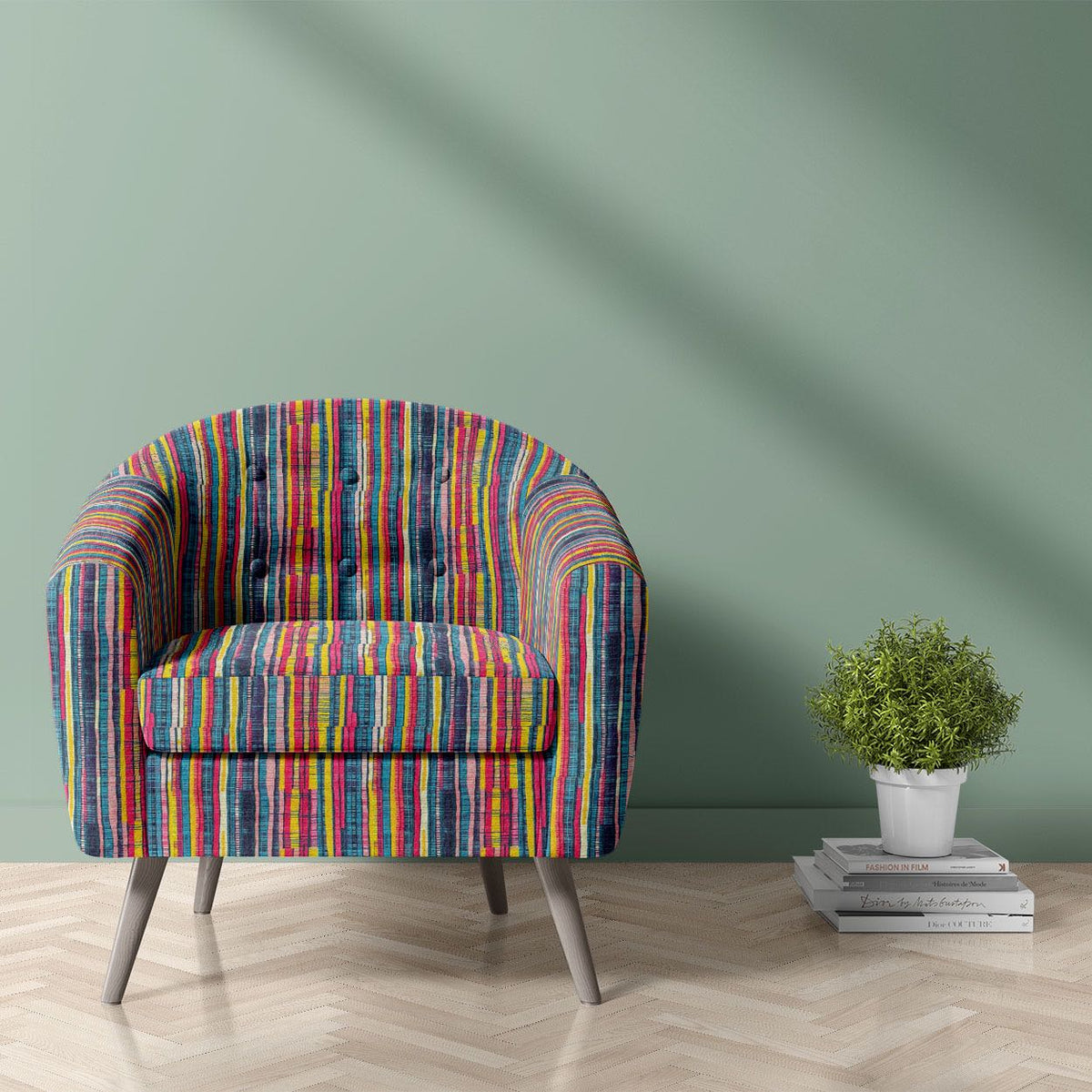 Striped No.10 teal, ochre, magenta and salmon irregular stripe Crib5 velvet upholstery fabric shown on a statement chair