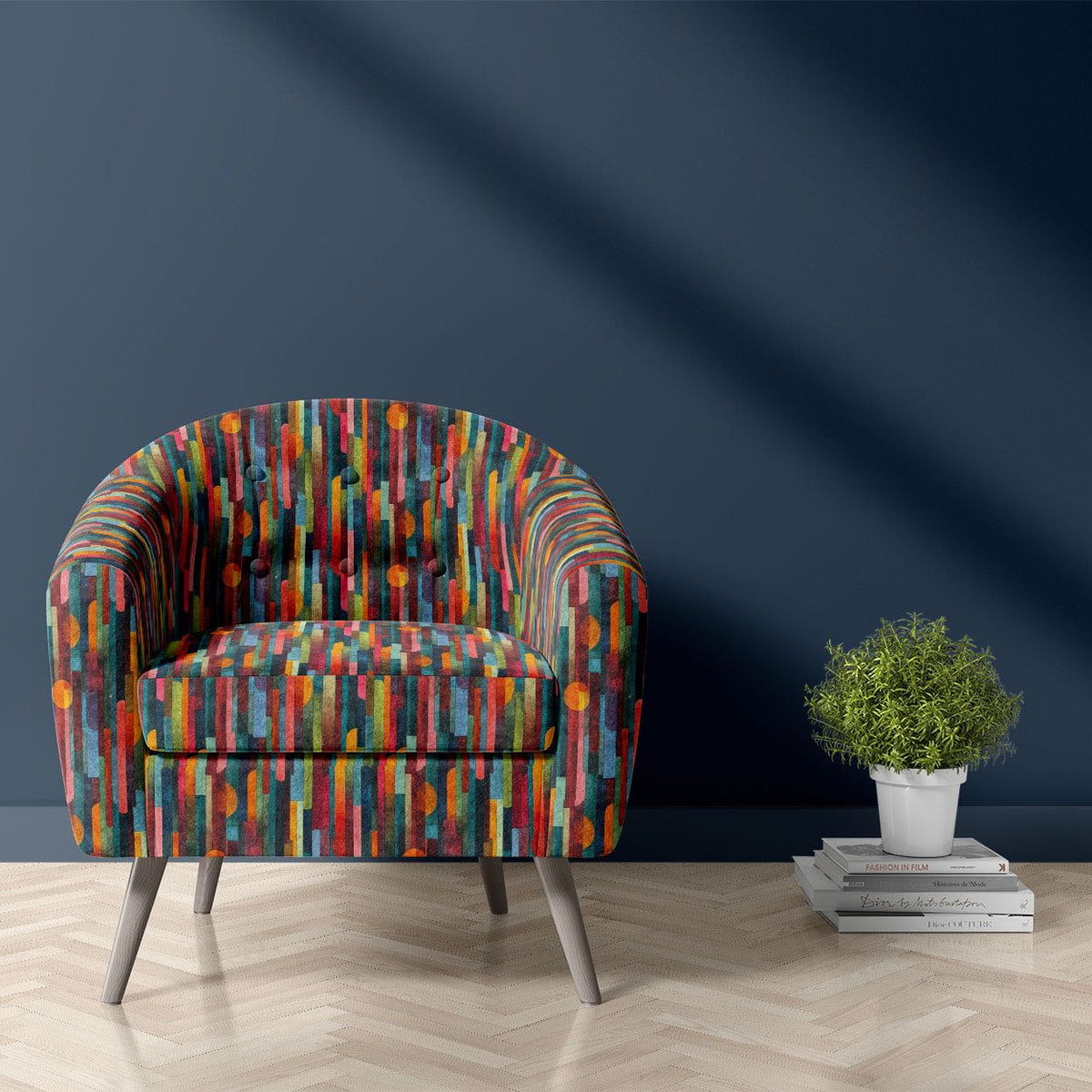Striped No.19 orange, teal, emerald and red mid-century stripe Crib5 velvet upholstery fabric shown on a statement chair