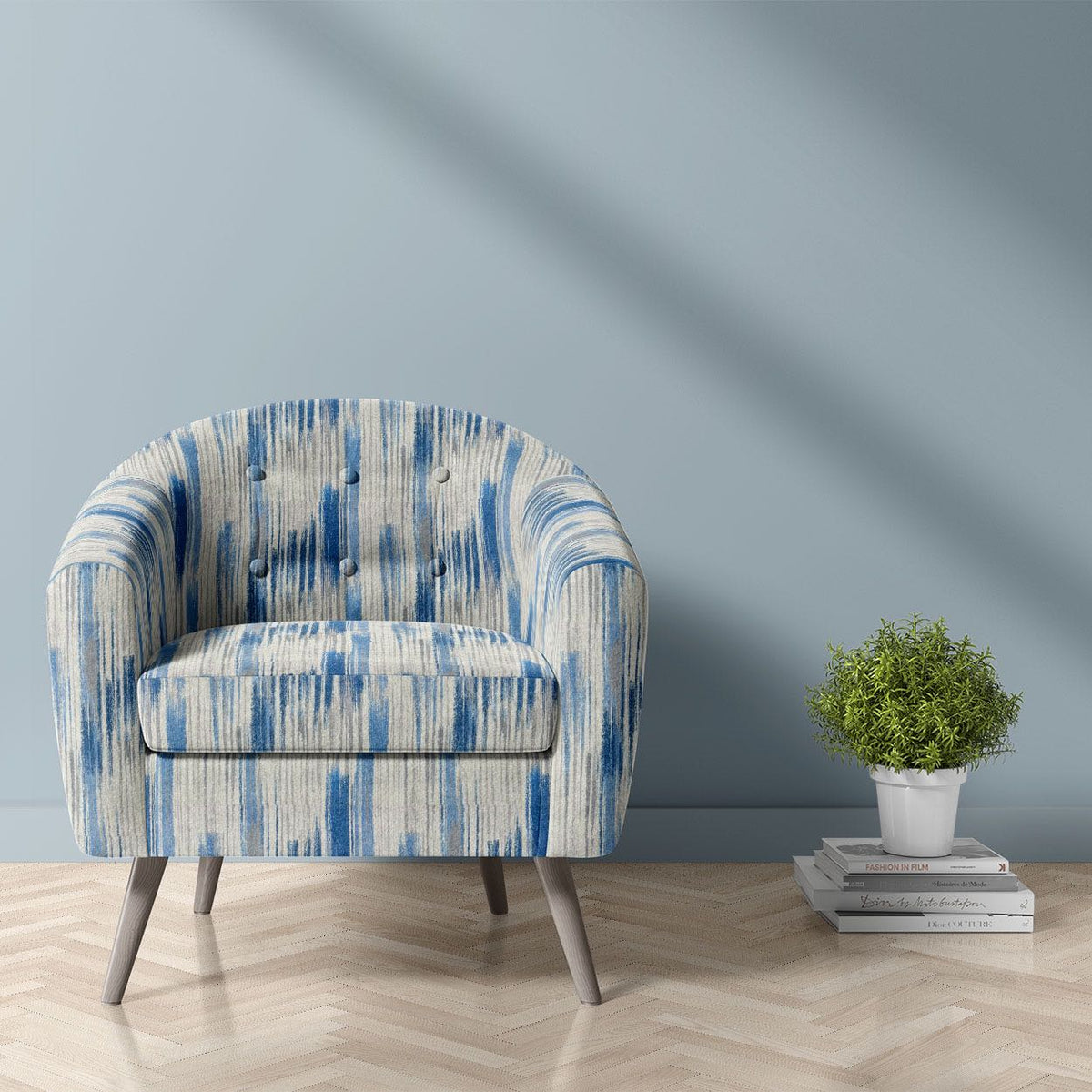 Striped No.21 blue and white painterly brushstroke stripe Crib5 velvet upholstery fabric shown on a statement chair