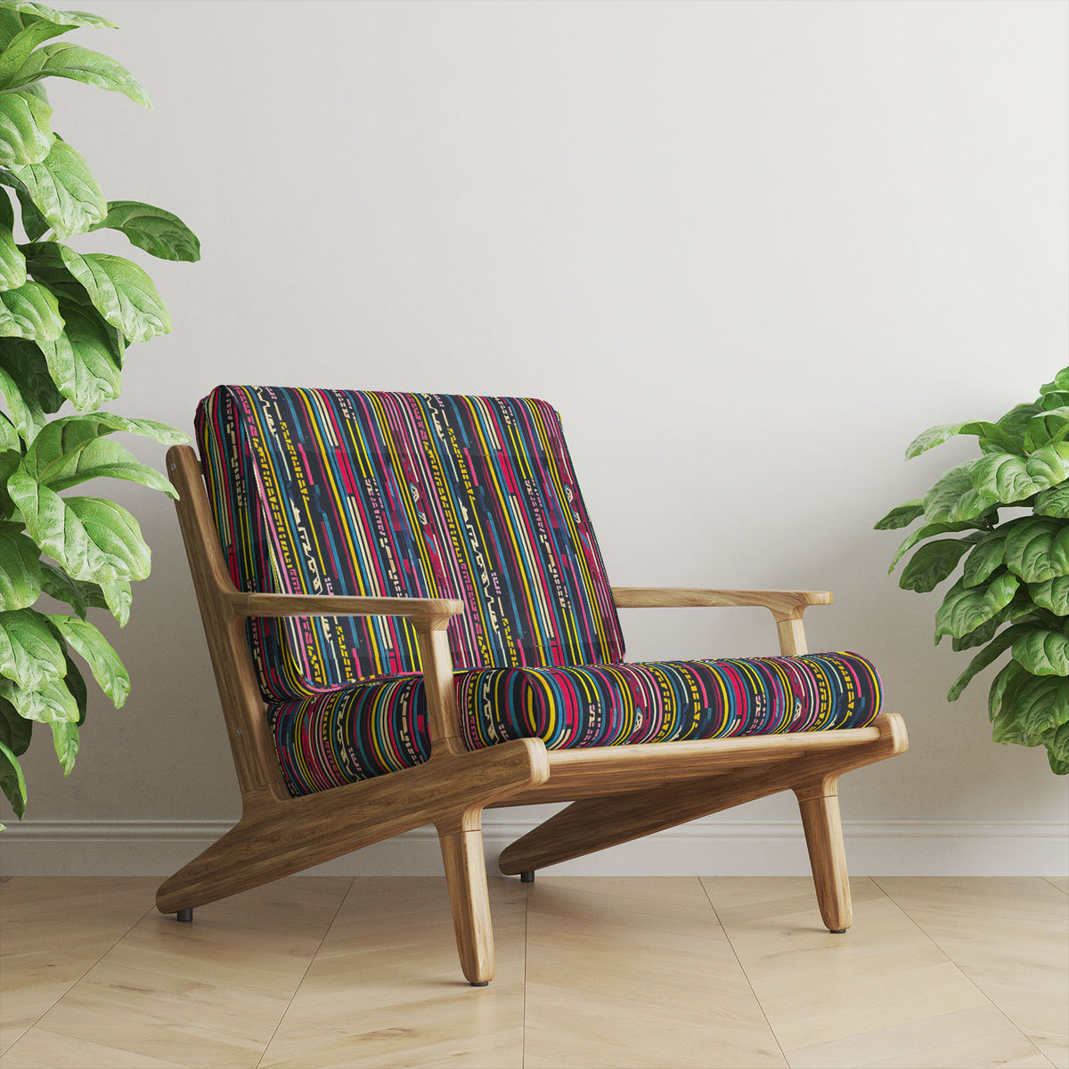 Striped No.6 pink, mustard, blue and charcoal geometric stripe Crib5 velvet upholstery fabric shown on a statement chair