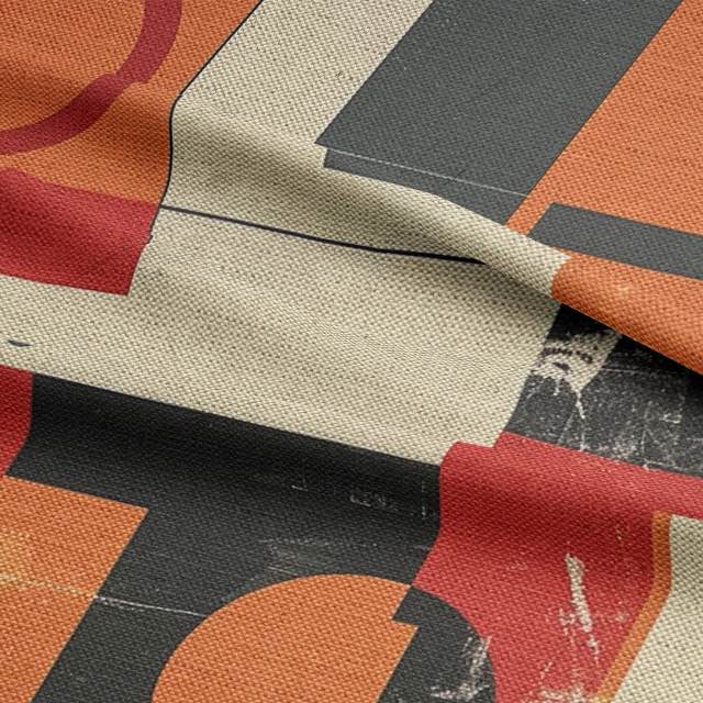 Upholstery fabric in orange, black, and cream with a textured finish