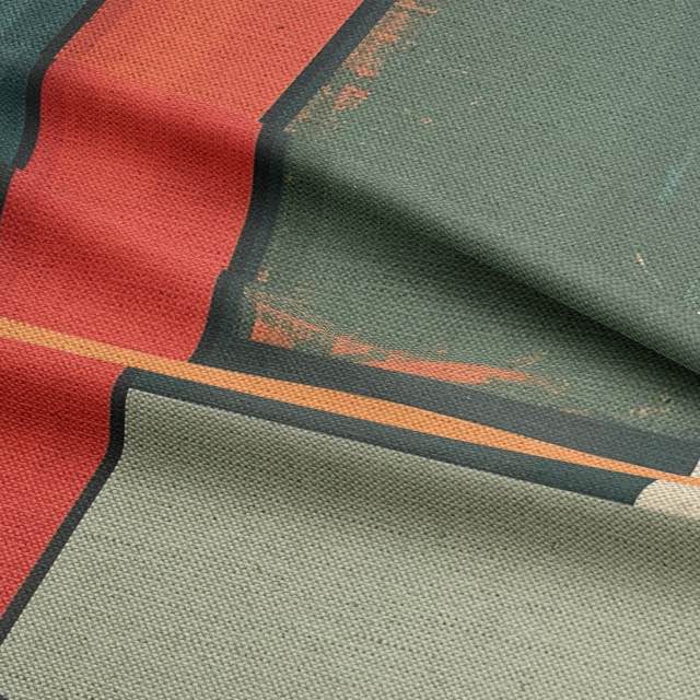 Close-up of textured teal upholstery fabric with curved graphic motifs