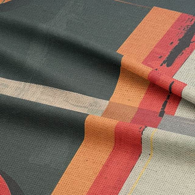 Upholstery fabric with teal base and distressed red and ochre shapes
