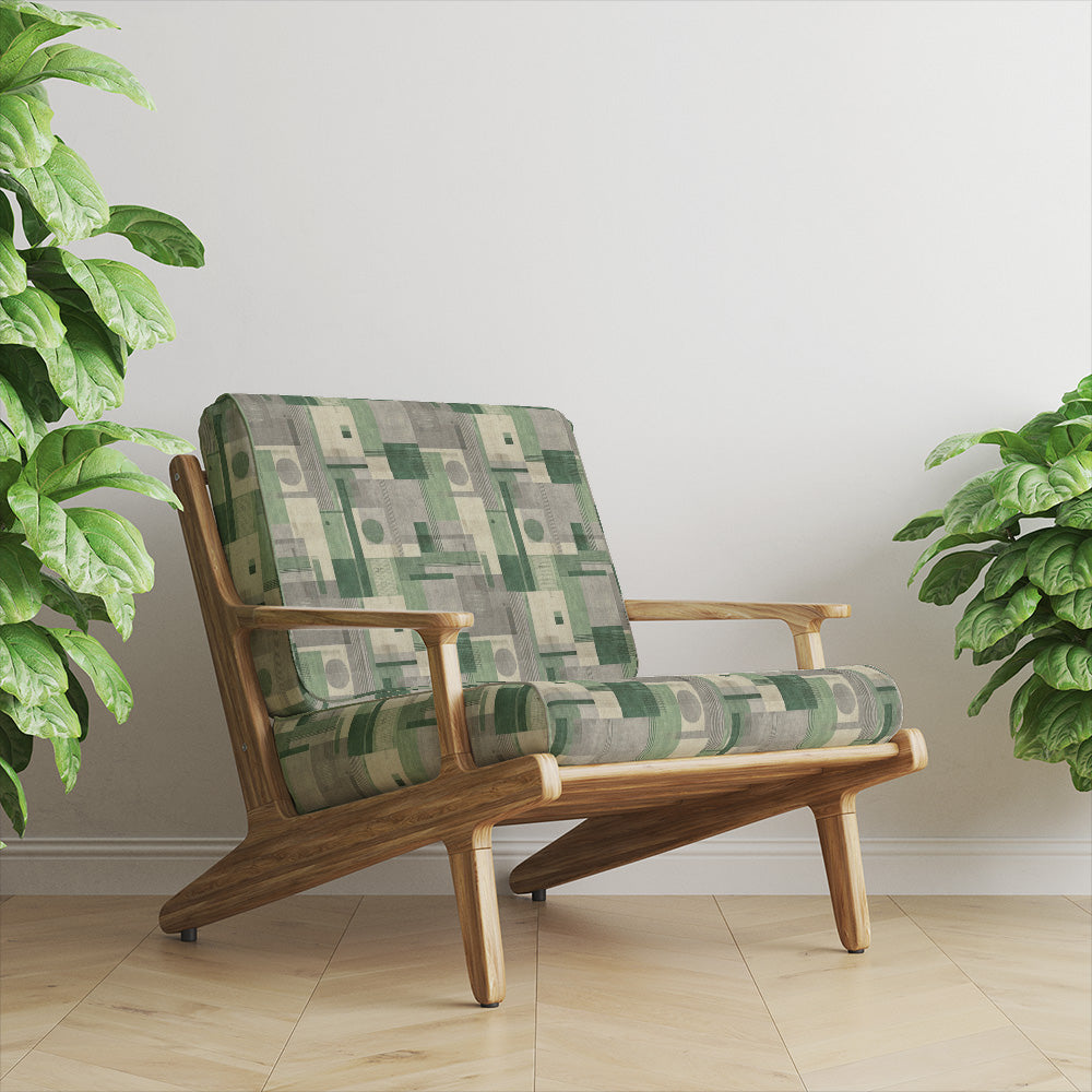 Texture No.11 green upholstery fabric on armchair featuring structured geometric design with layered green tones and soft neutral basecloth