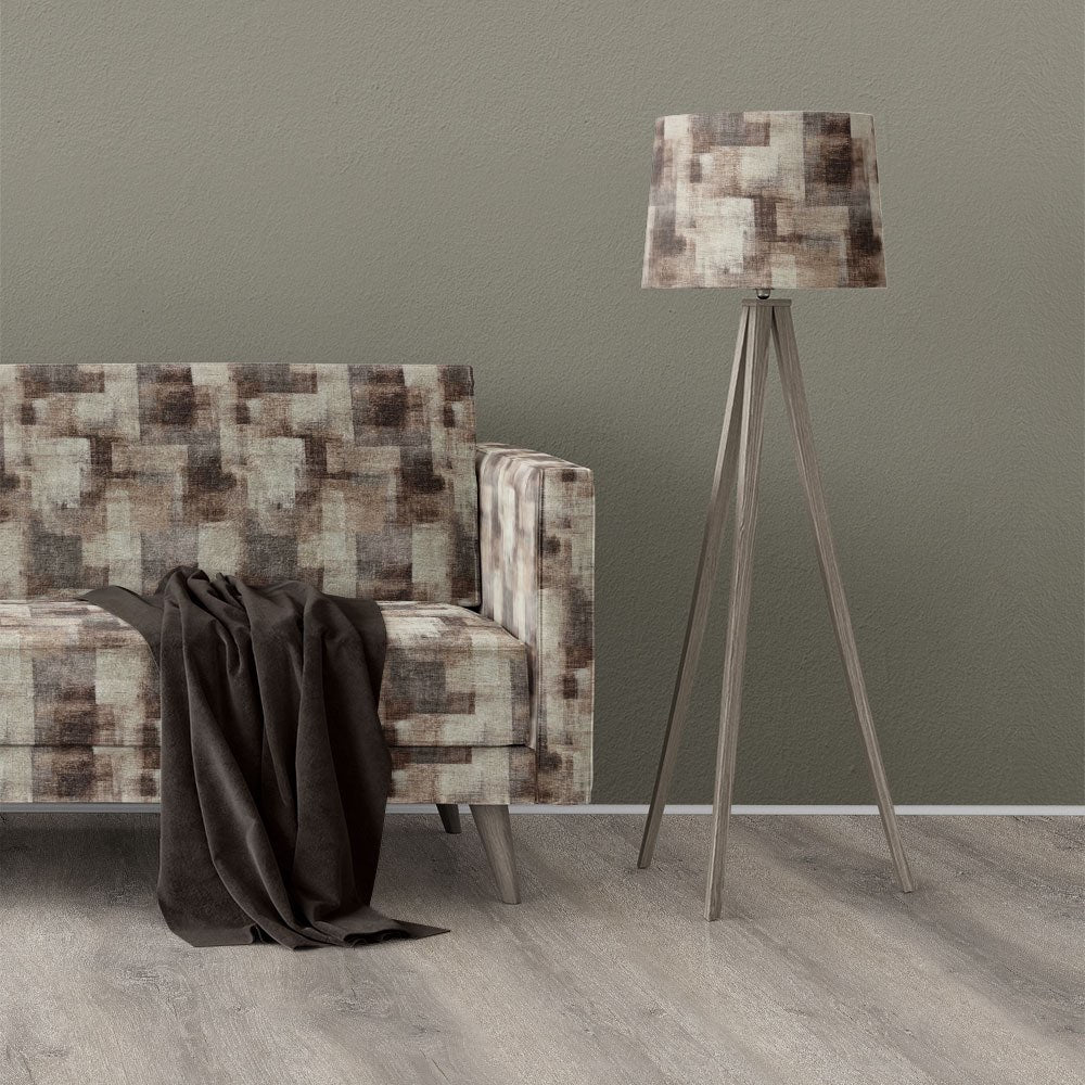 Texture No.4 brown upholstery fabric on sofa featuring a printed layered texture design with warm neutral tones and geometric blocks