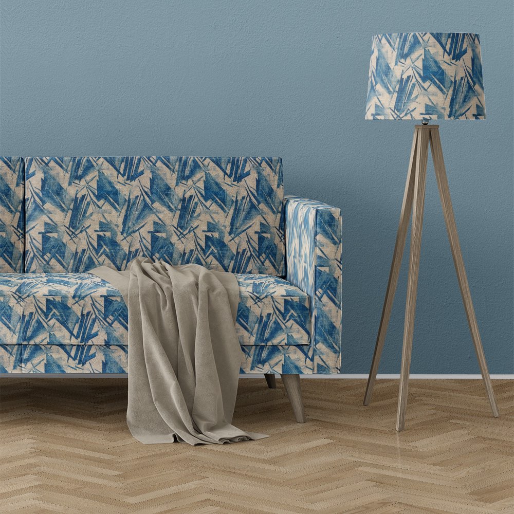 Texture No.7 blue upholstery fabric on sofa featuring bold geometric brushstroke pattern in layered blue tones with printed texture effect
