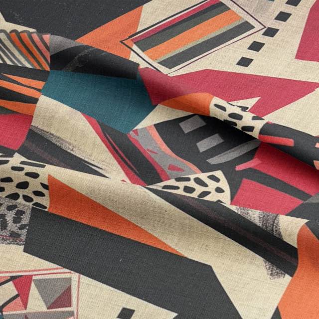 Folded close-up of multicoloured upholstery fabric with bold tribal patterns