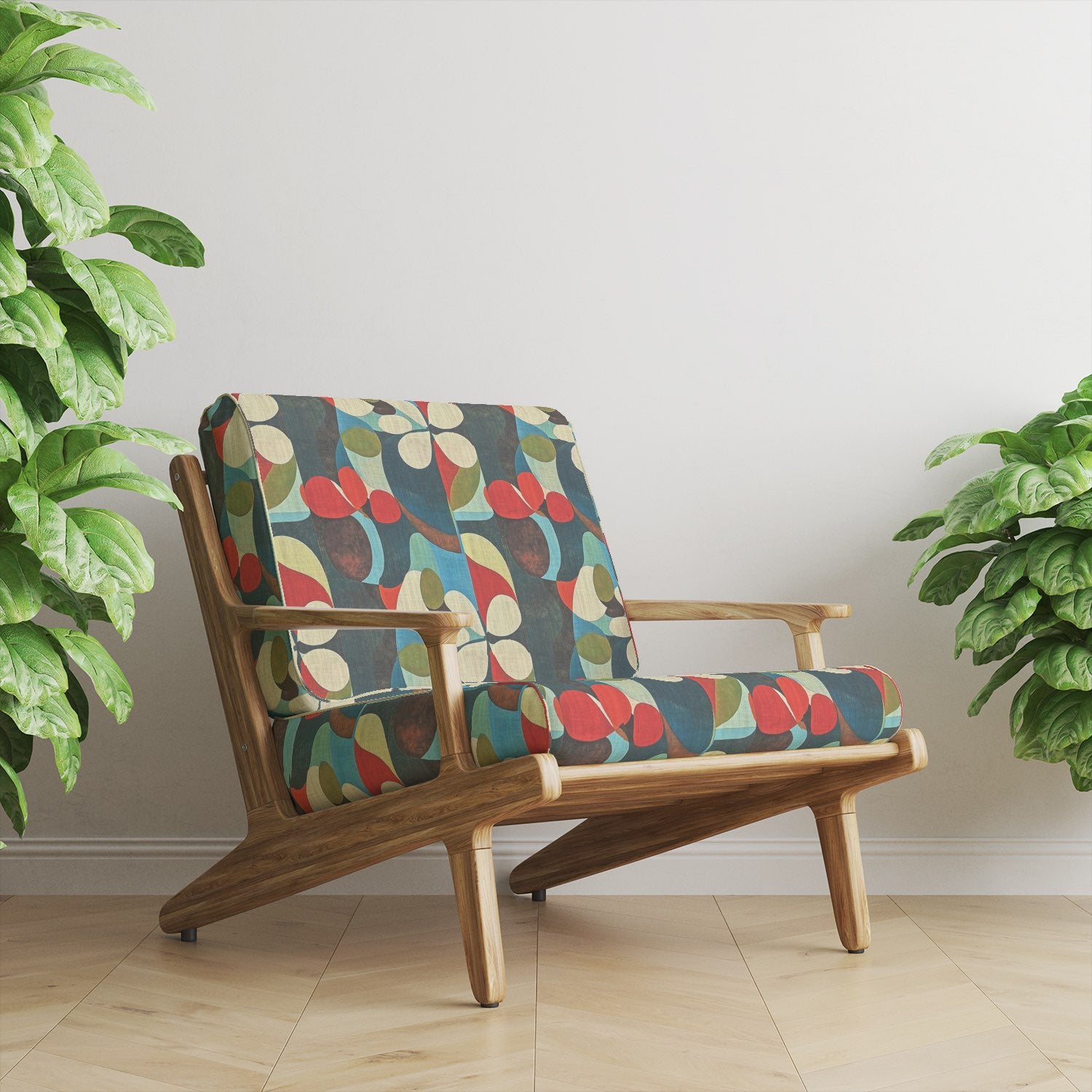 Armchair upholstered in Tulpan No.9 floral upholstery fabric with red, olive and blue palette