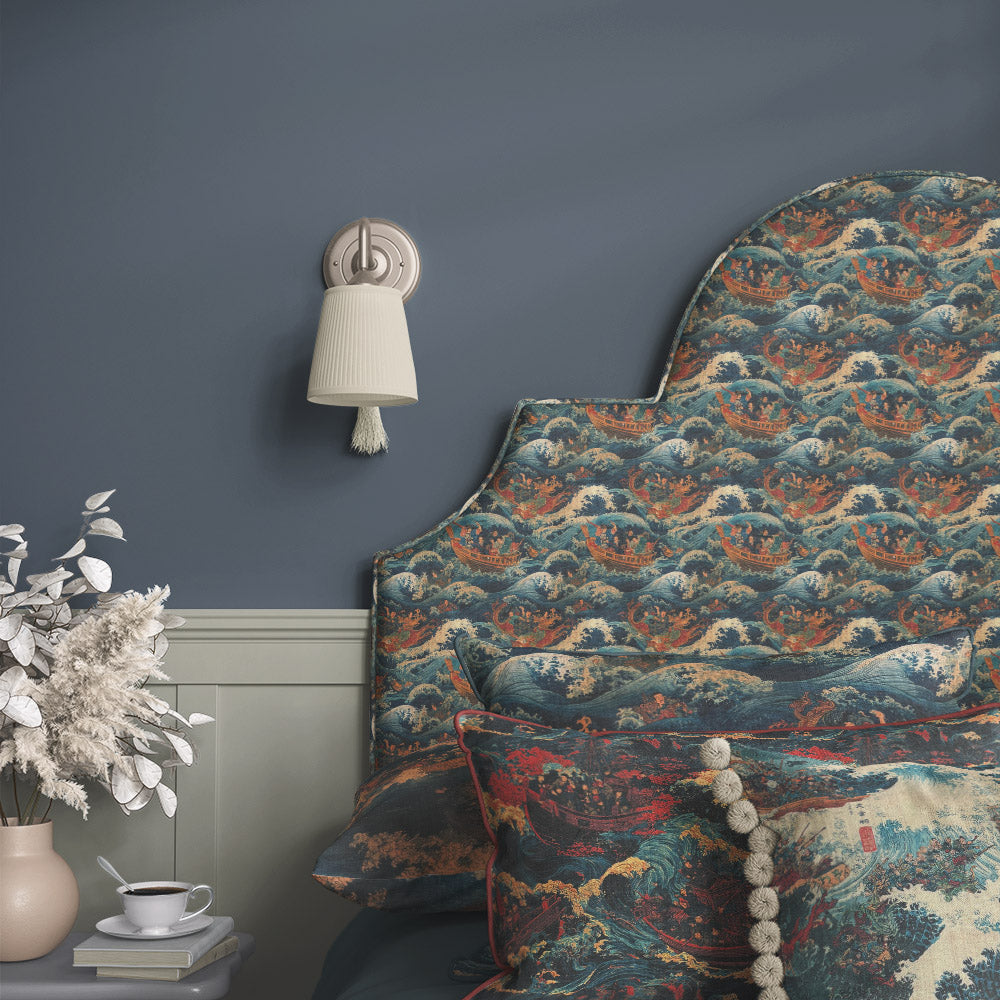 Ukiyo No.7 Japanese style upholstery fabric displayed on upholstered headboard with dragons, sailing vessels and decorative maritime artwork